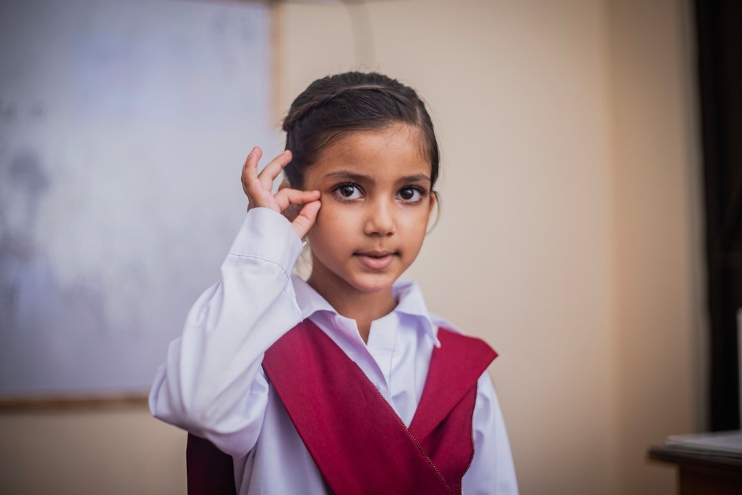A small cute students practice for speaking and hearing in sign language